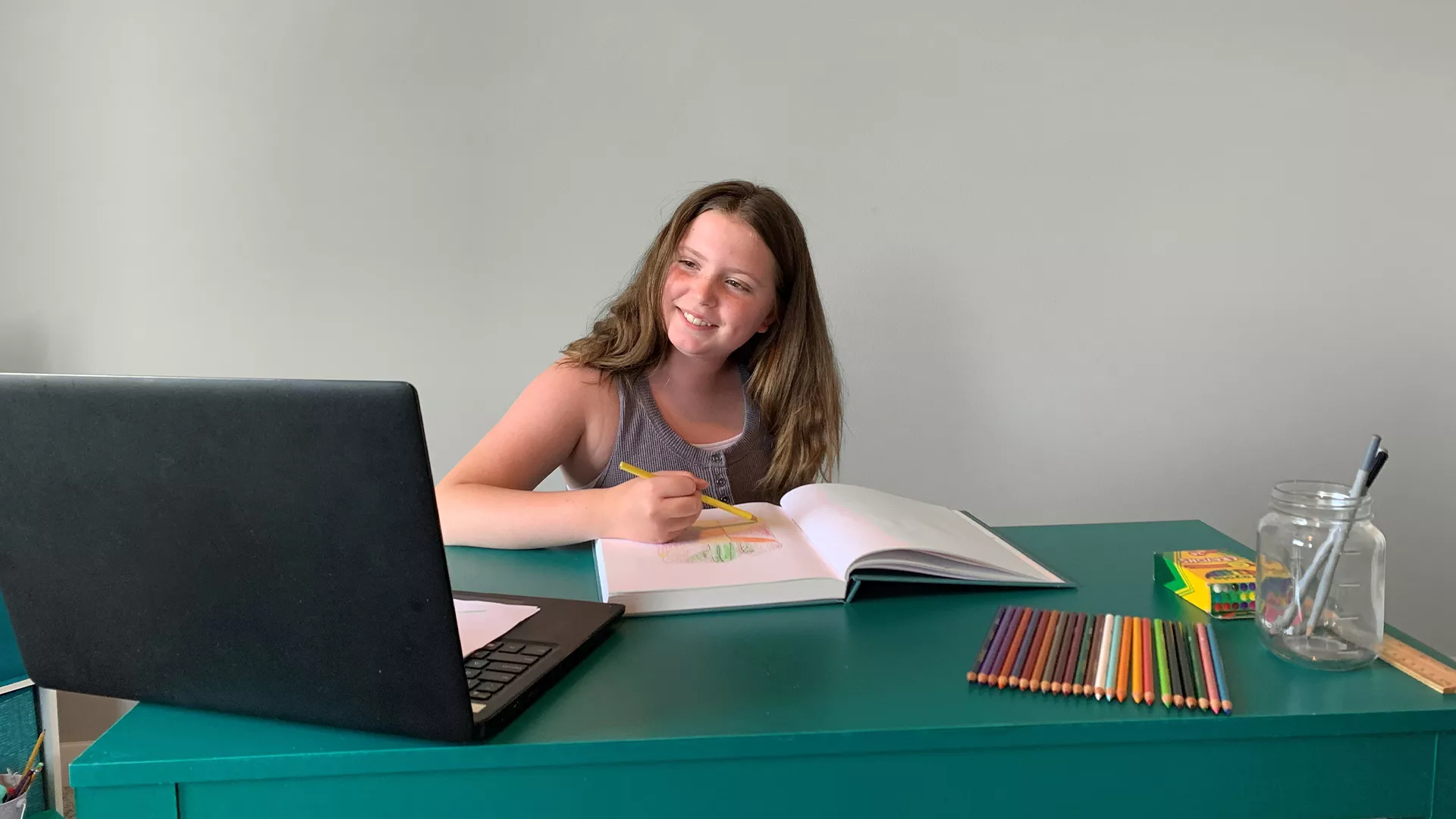 Photo of girl enjoying an online art class