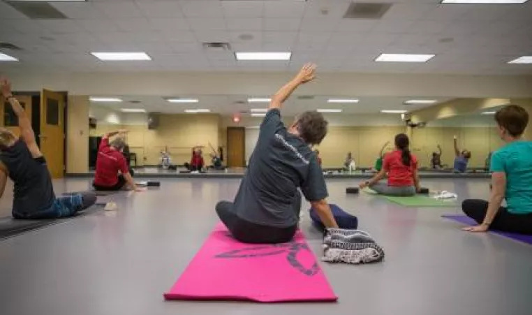 Woman doing a yoga pose in a yoga class