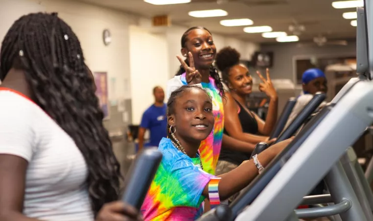 Girls on the exercise equipment at teen night