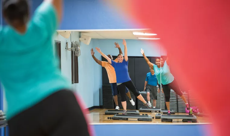 People participating in a Step exercise class