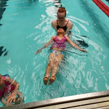 Photo of children participating in swimming lessons