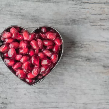 Photo of pomegranate seeds in the shape of heart